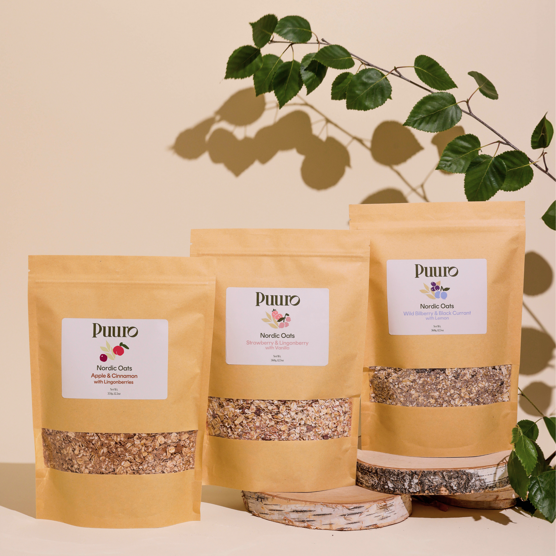 Three bags of oatmeal on birch with a birch leaves