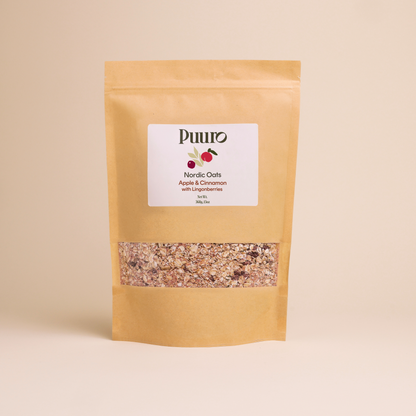 bag of apple cinnamon oats with lingonberries on a beige background
